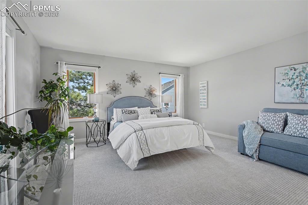 secondary suite with attached bathroom and walkin closes