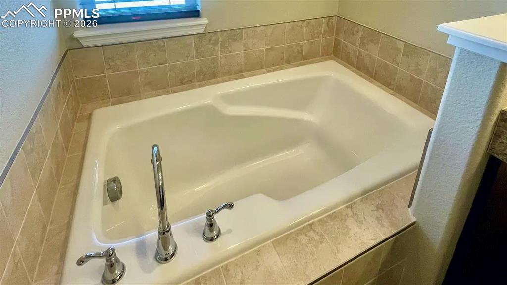 Deep soaking tub in the primary bath