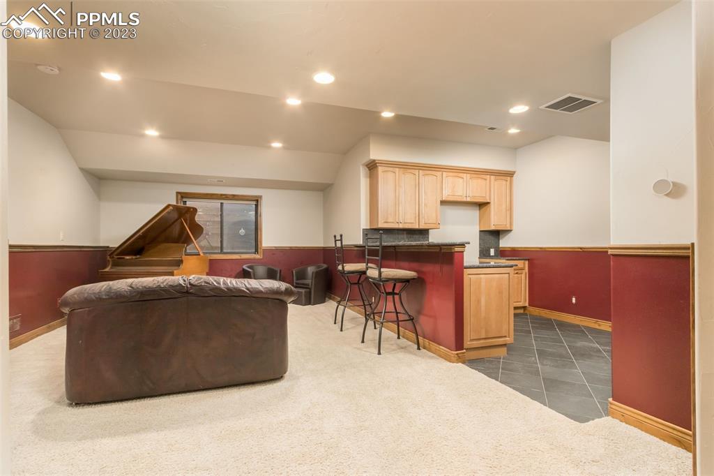 The basement entertainment areas continues with large family room with attached kitchen. 