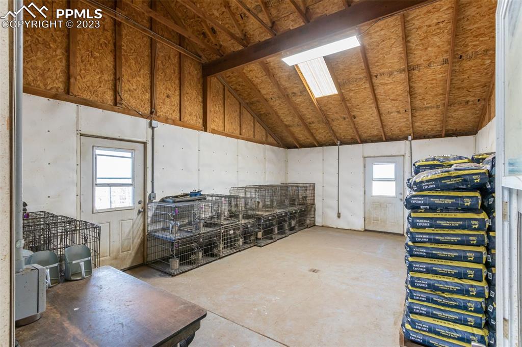 Finished barn area with LED lighting, water, and cement floors