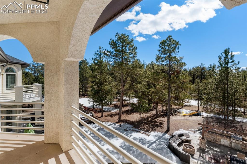 Balcony featuring an outdoor fire pit
