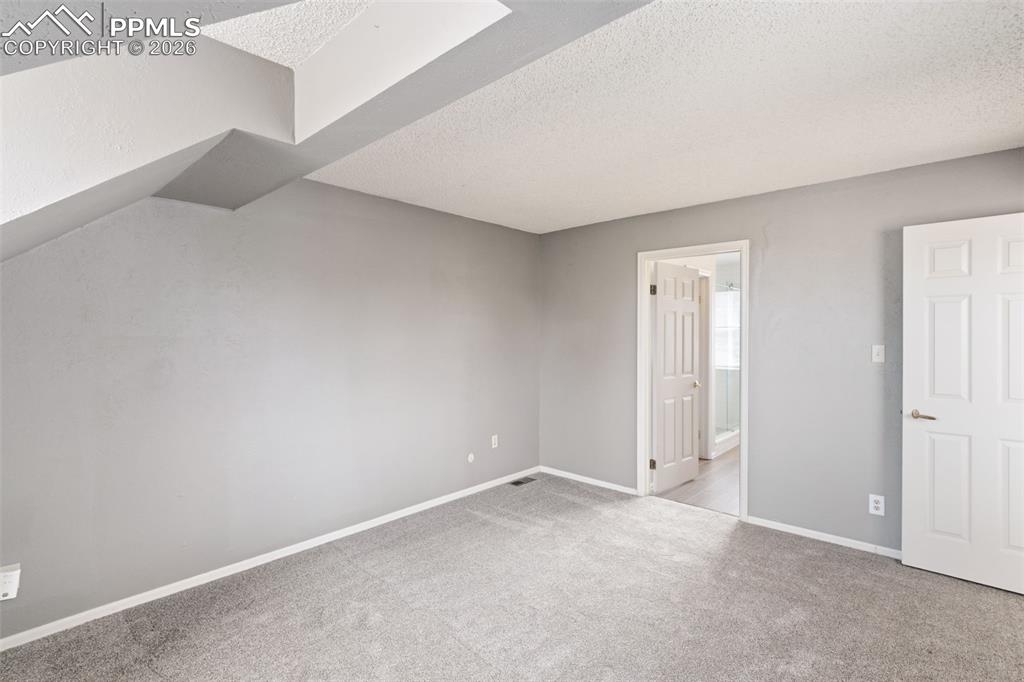 Primary Bedroom with adjoining bathroom and walk-in closet