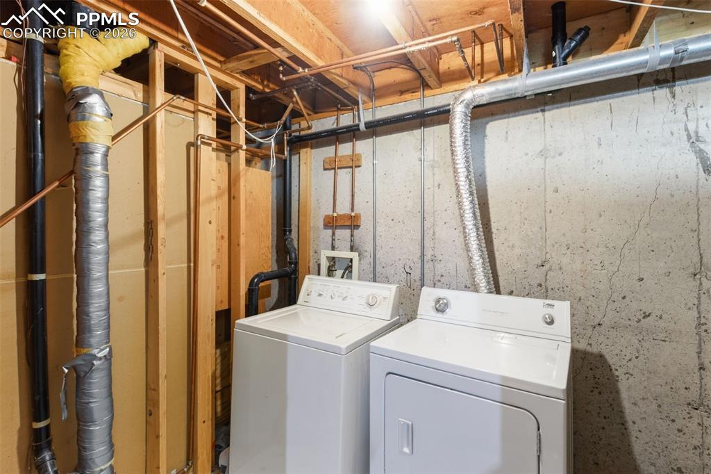 Laundry area featuring separate washer and dryer