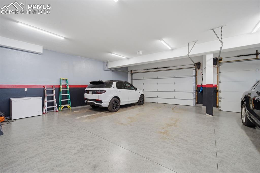 Garage featuring white fridge