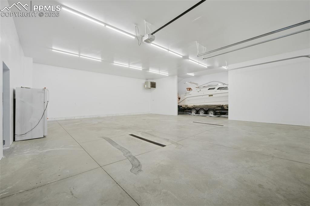 Parking deck with freestanding refrigerator and a garage door opener