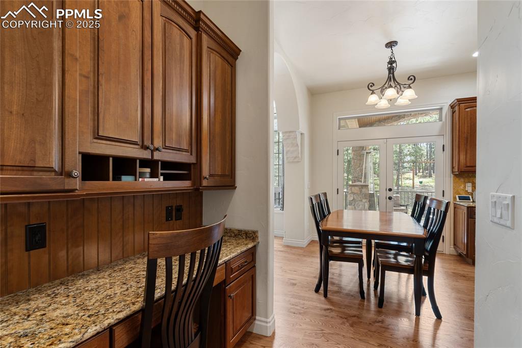 There is an adjacent built in desk that could be used for many things, including a coffee bar.