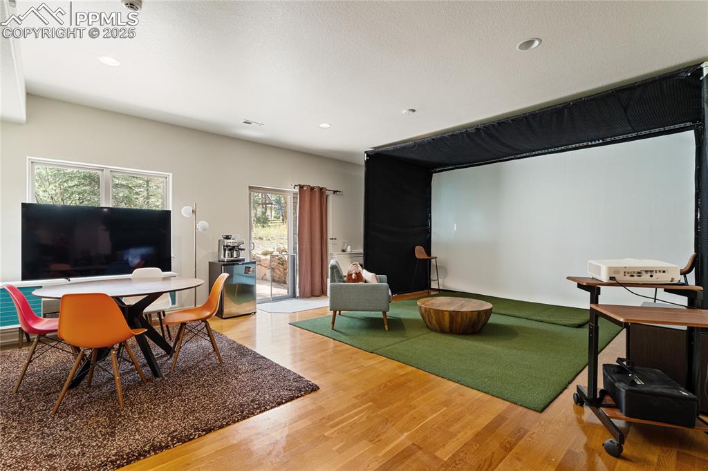 The lower level has a large rec area with golf simulator.