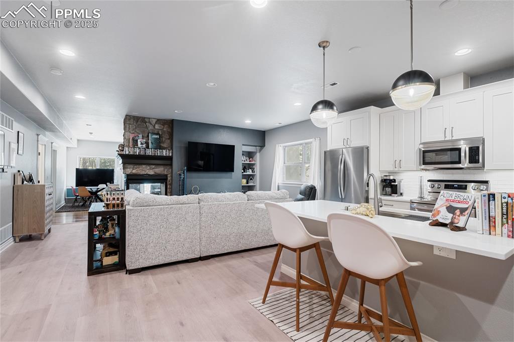 The lower level is equipped with a full kitchen.