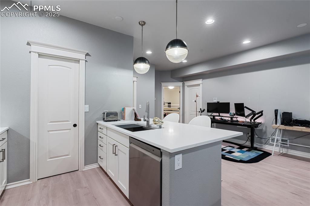 The kitchen has a pantry, quartz counter tops.
