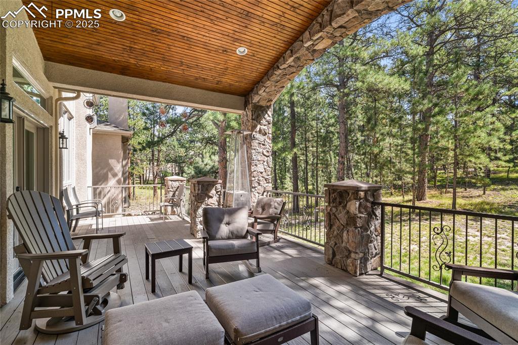 Wooden deck featuring outdoor lounge area