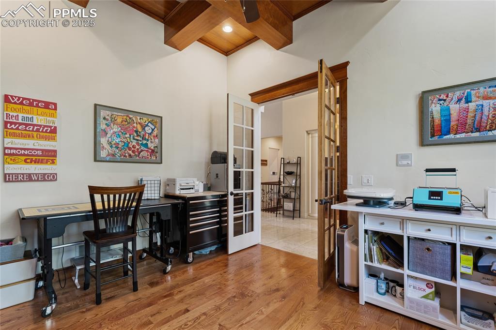 This office with beamed ceilings is a show stopper! There are 10' ceilings and french doors.