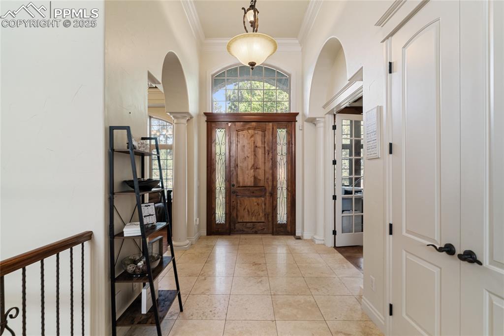 Adjacent is a dining room with soaring ceilings and lots of light.