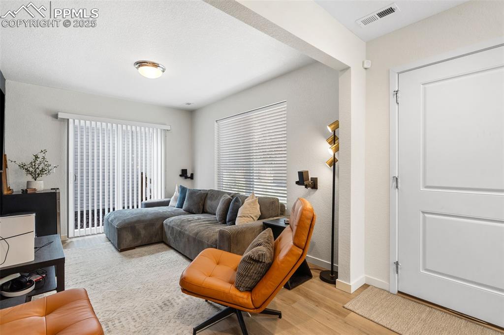 1st floor entry with attached flex-room and slider door to side yard