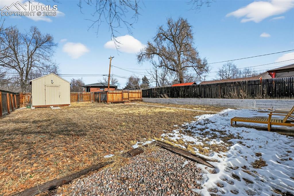 Back yard with storage shed and alley access