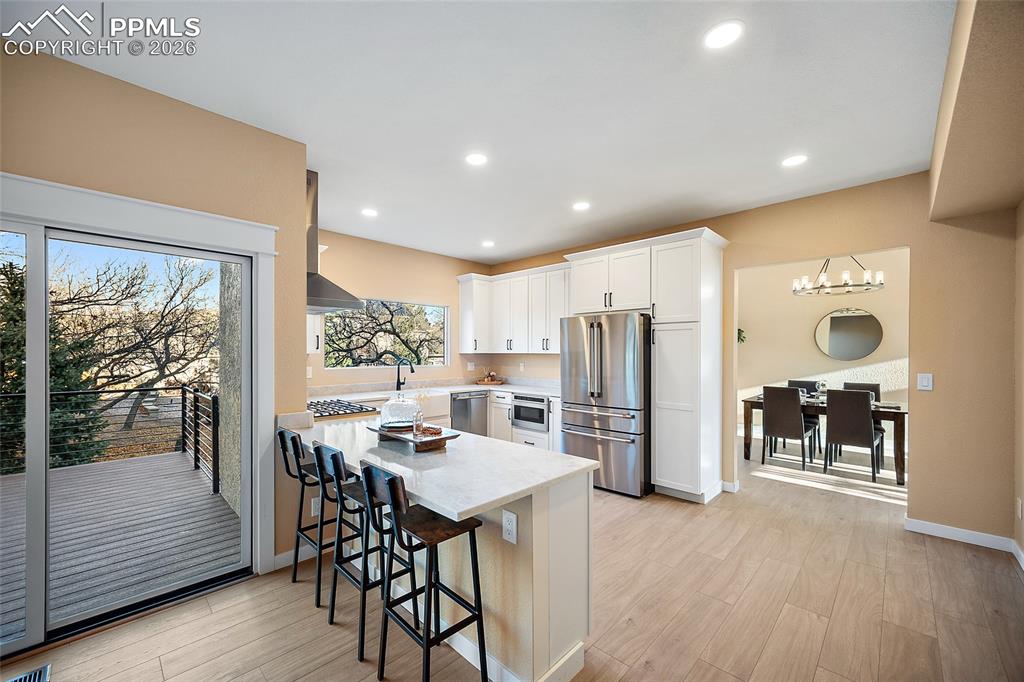 Newly renovated kitchen featuring quartz counter tops, new Cafe appliances, and new cabinetry