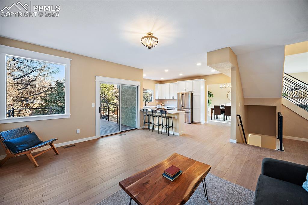 View of living room, kitchen and walkout