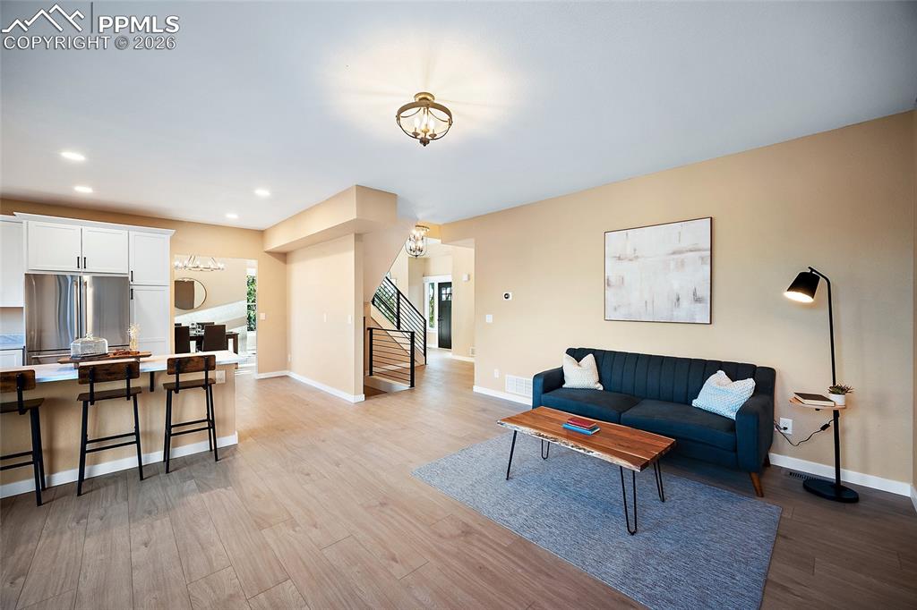 Living area featuring recessed lighting and and LVP flooring