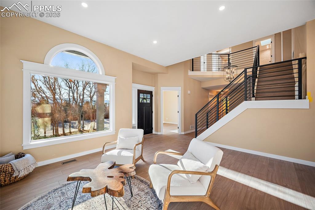 Entry, living area, newly installed iron banisters