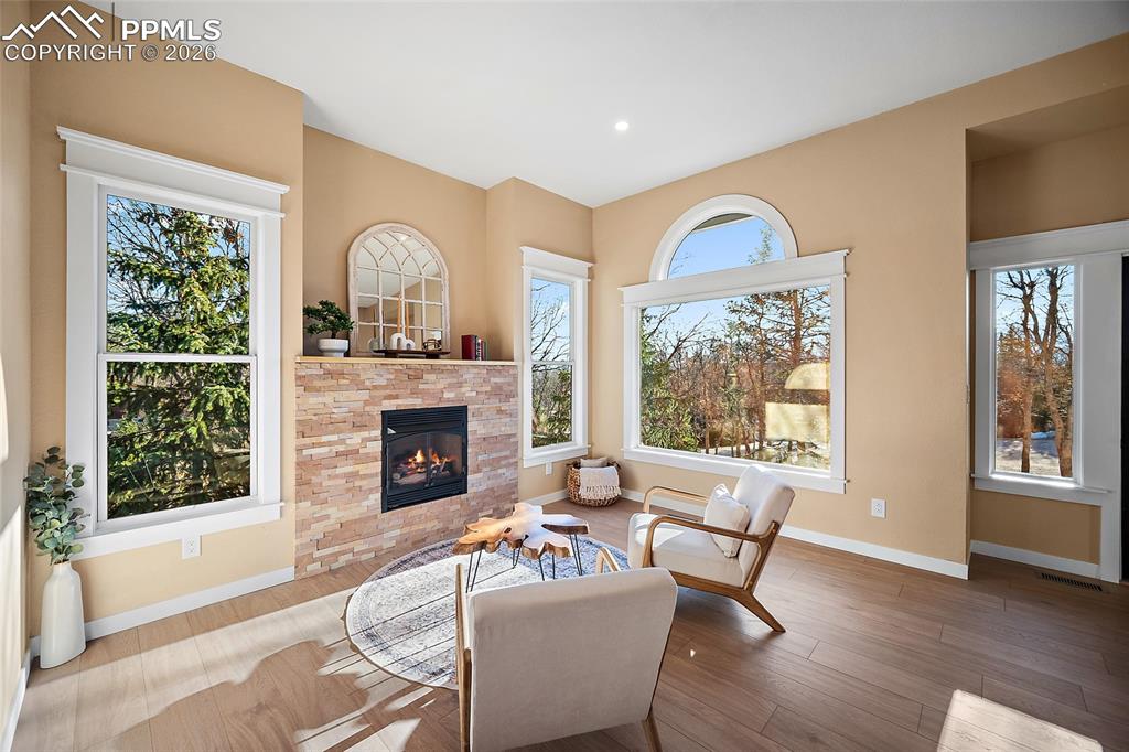 Warm and cozy living area with new gas fireplace and bright open windows