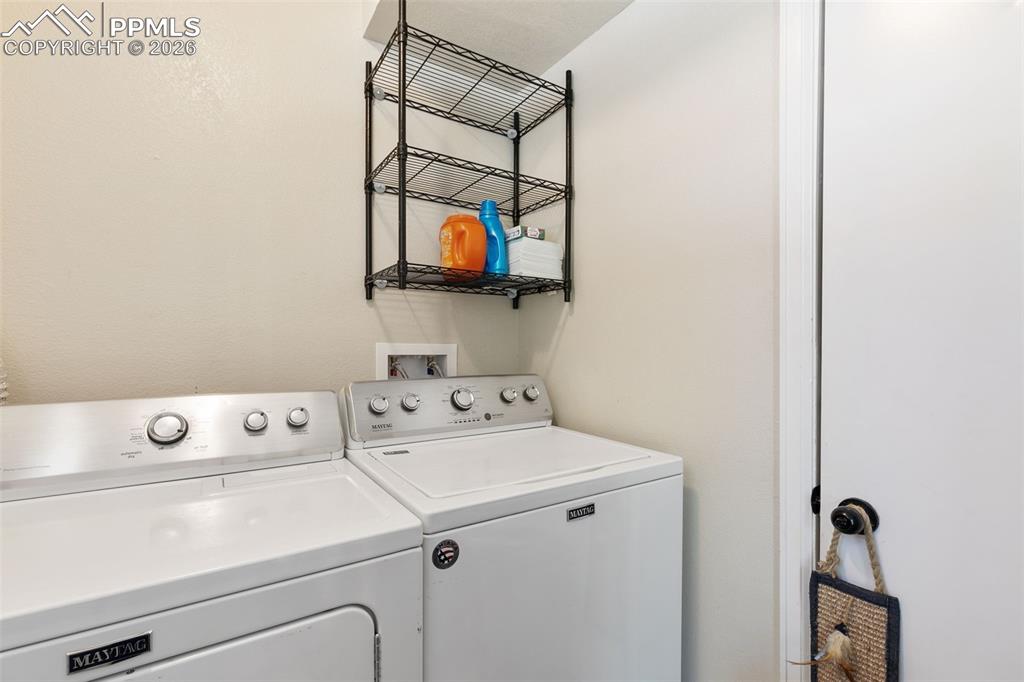 Laundry room featuring washing machine and clothes dryer