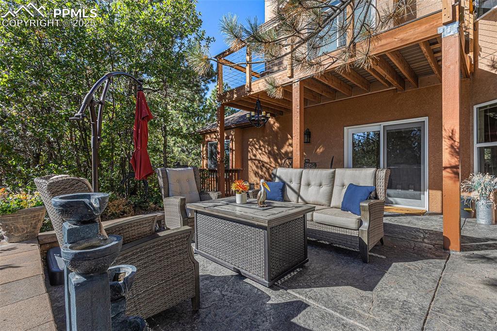 View of patio featuring a hot tub and outdoor dining space