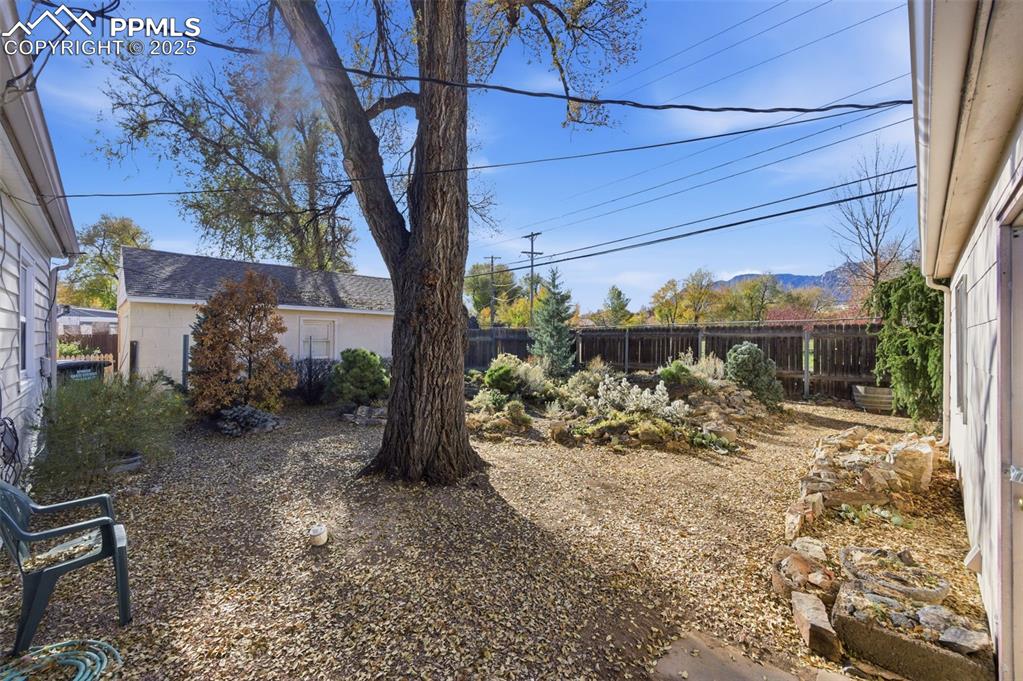 View of fenced backyard