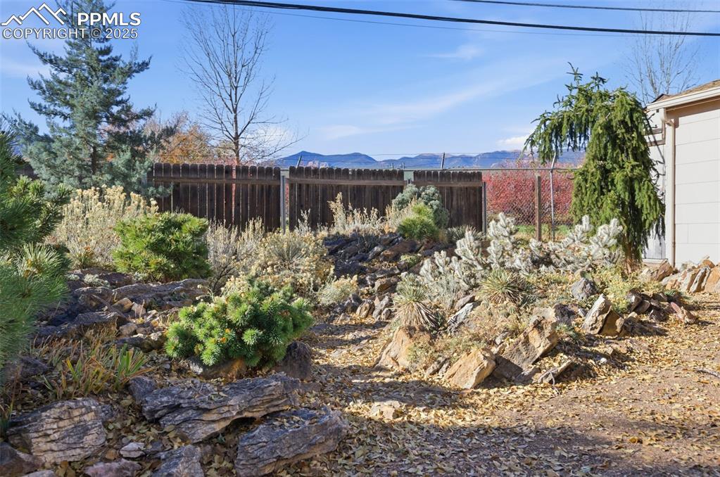 View of yard with a mountain view