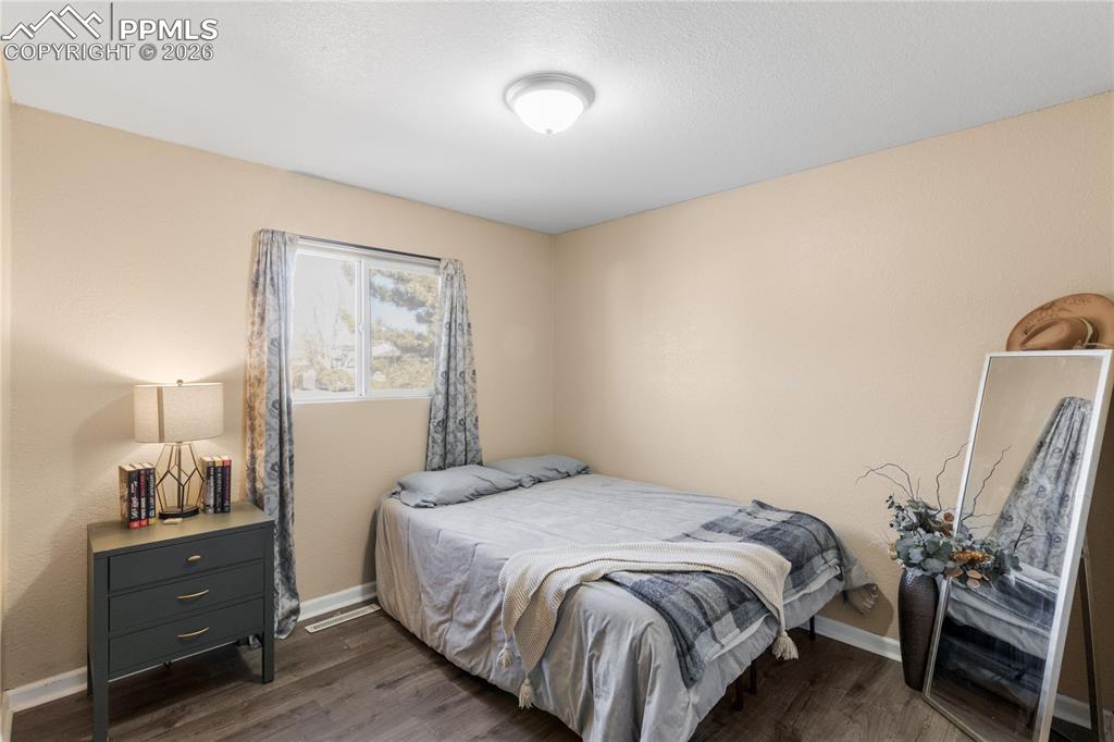 Bedroom featuring dark wood finished floors