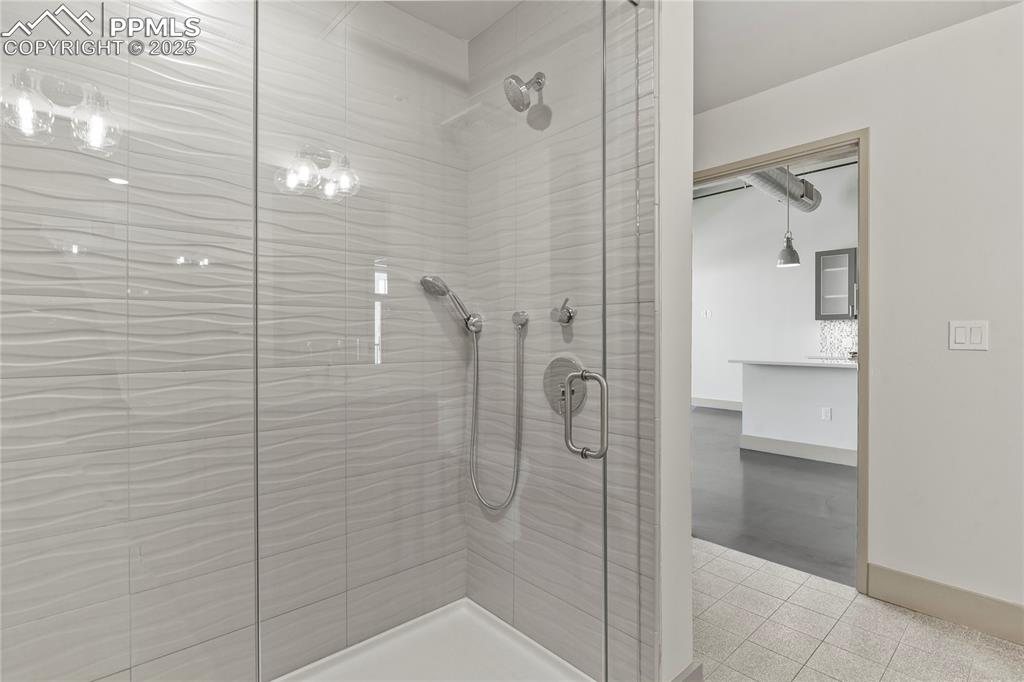 Huge walk-in shower with frameless glass door
