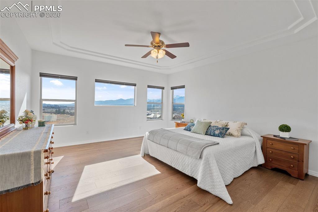 Bedroom with light wood finished floors and ceiling fan