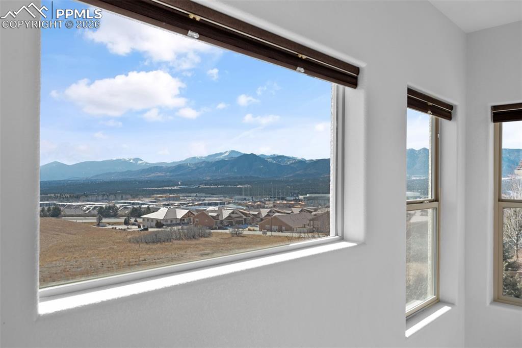 View of mountain backdrop featuring nearby suburban area