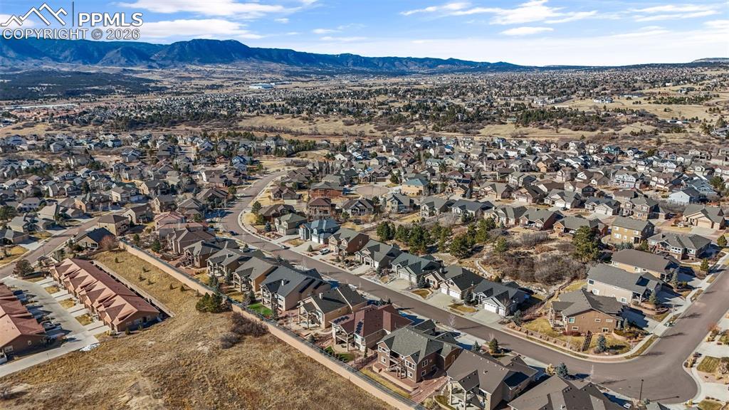 Aerial view of residential area featuring mountains