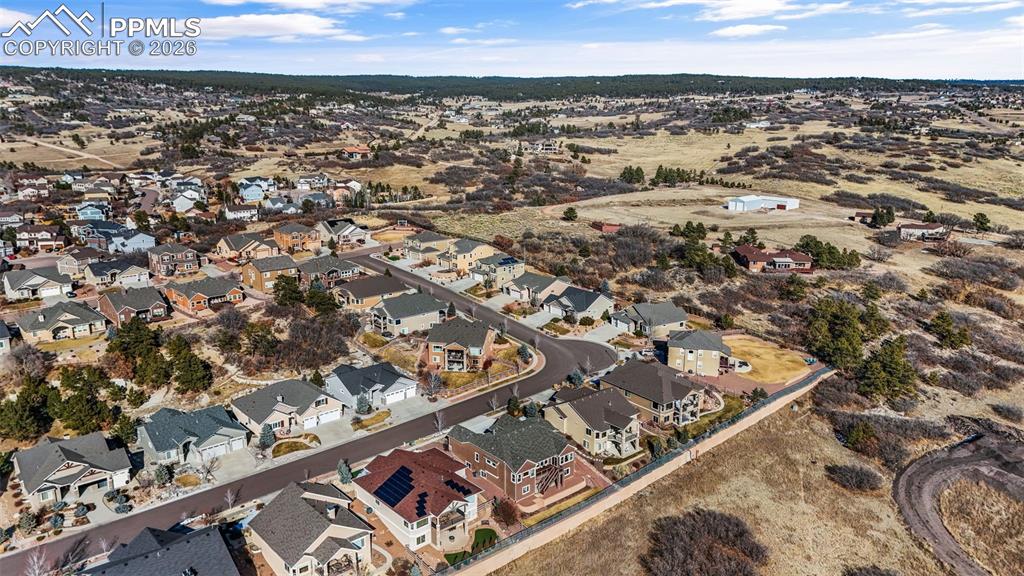 Aerial view of property's location featuring nearby suburban area