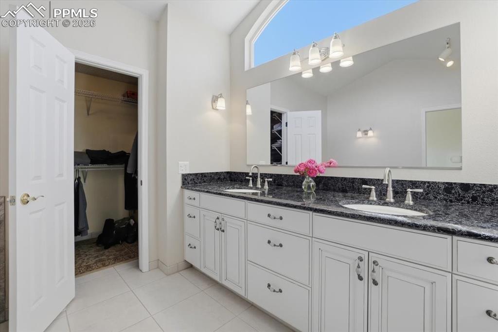 Primary bathroom with tons of natural light and walk-in closet.