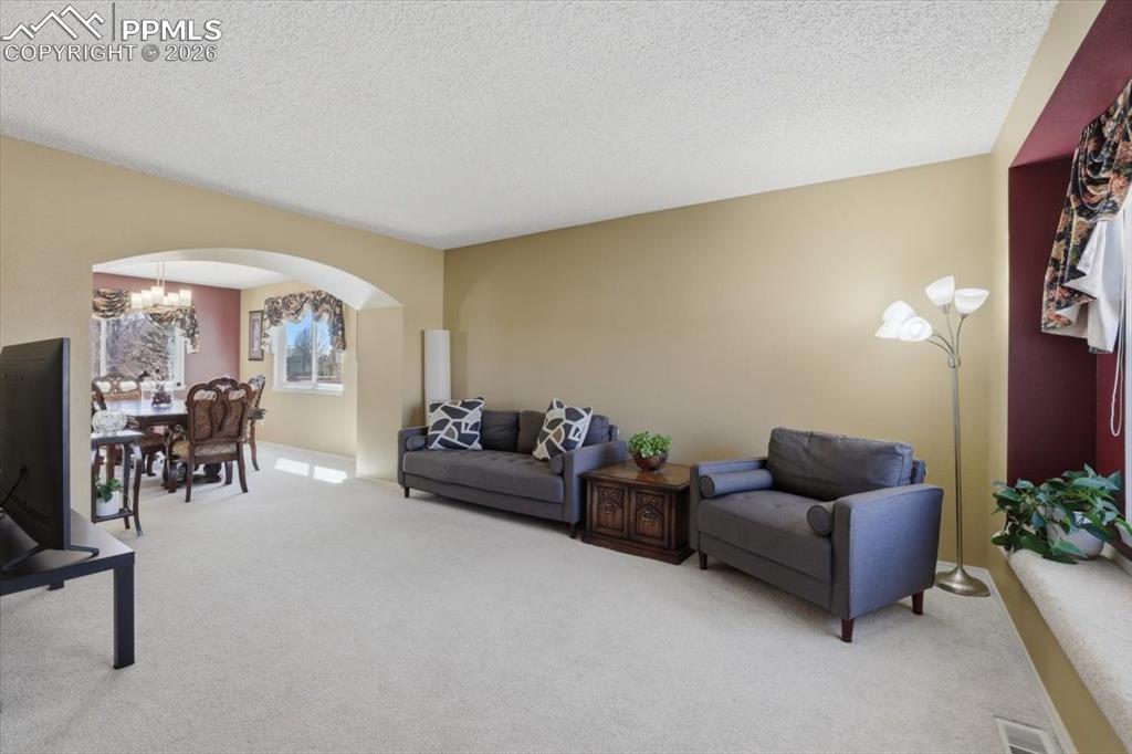Formal living room opens to the formal dining room.