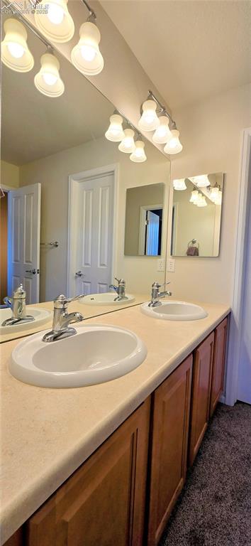 Full bath featuring double vanity