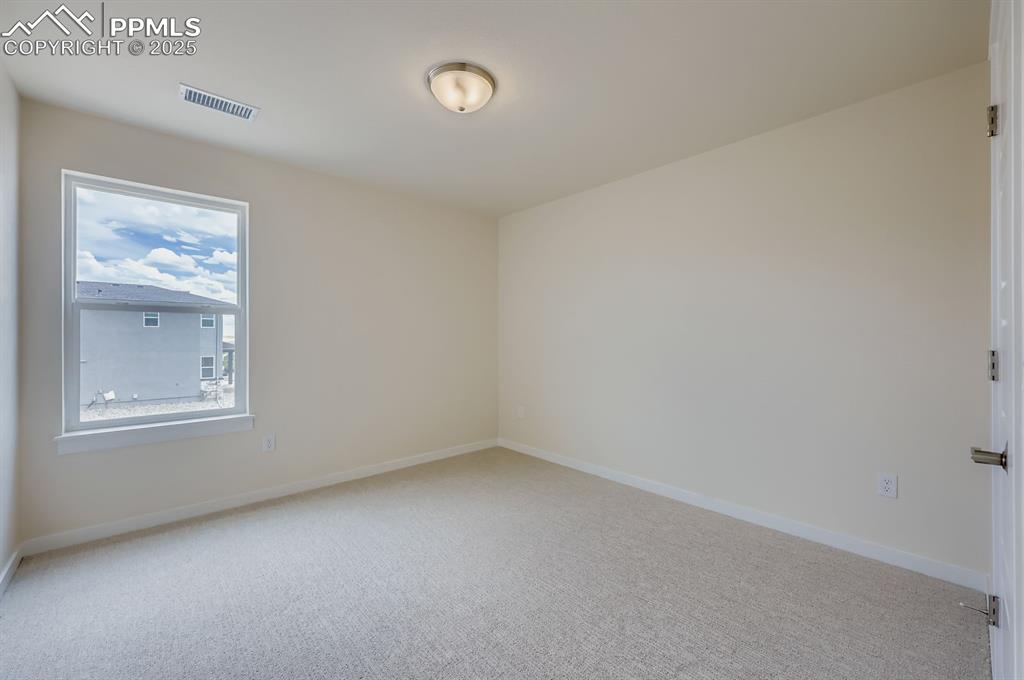 Spare room with carpet flooring