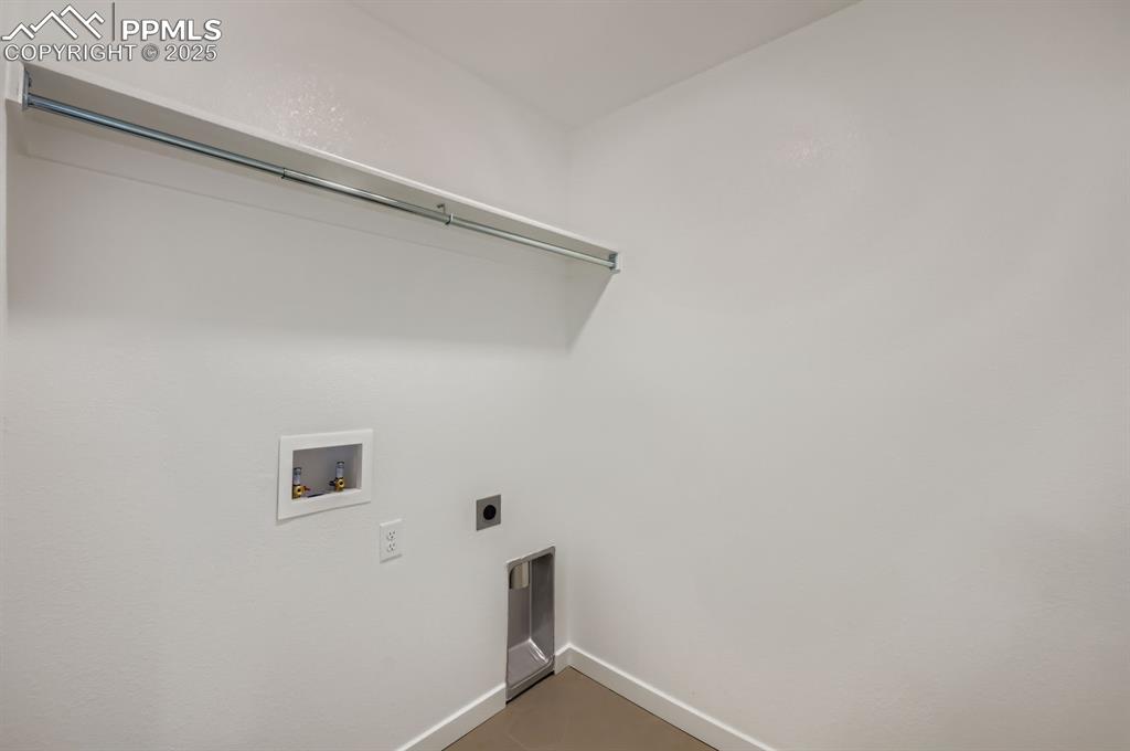 Laundry area with hookup for a washing machine and hookup for an electric dryer