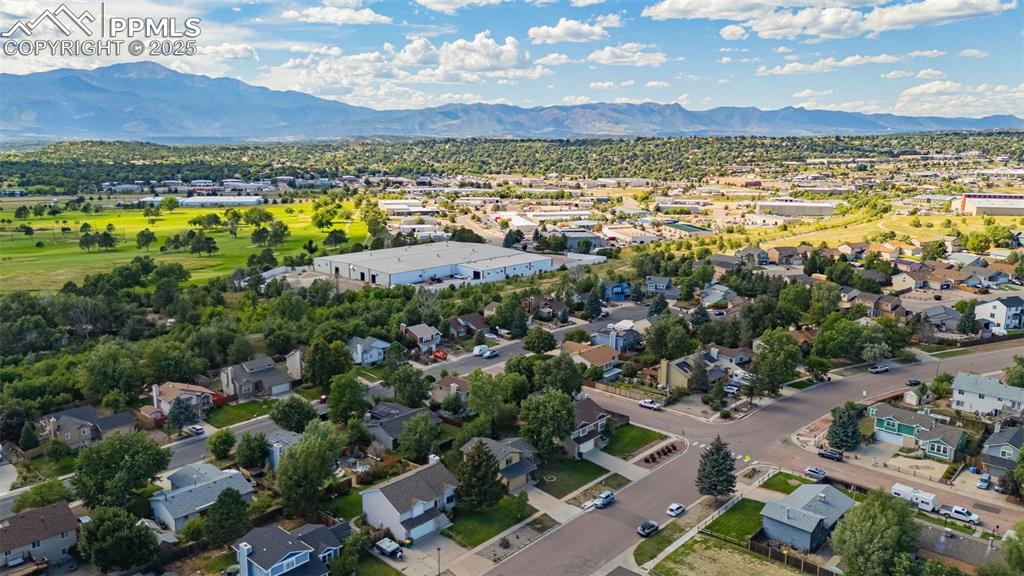 Aerial view of residential area featuring a mountainous background