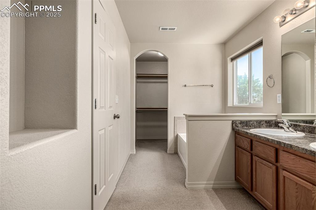 Primary Bathroom and Walk In Closet