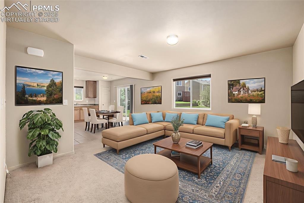 Virtually Staged - The bright and open living room offers ample space and an open floor plan