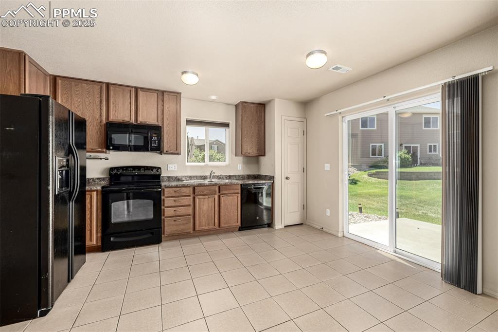 The eat in kitchen features a walk out to the back patio