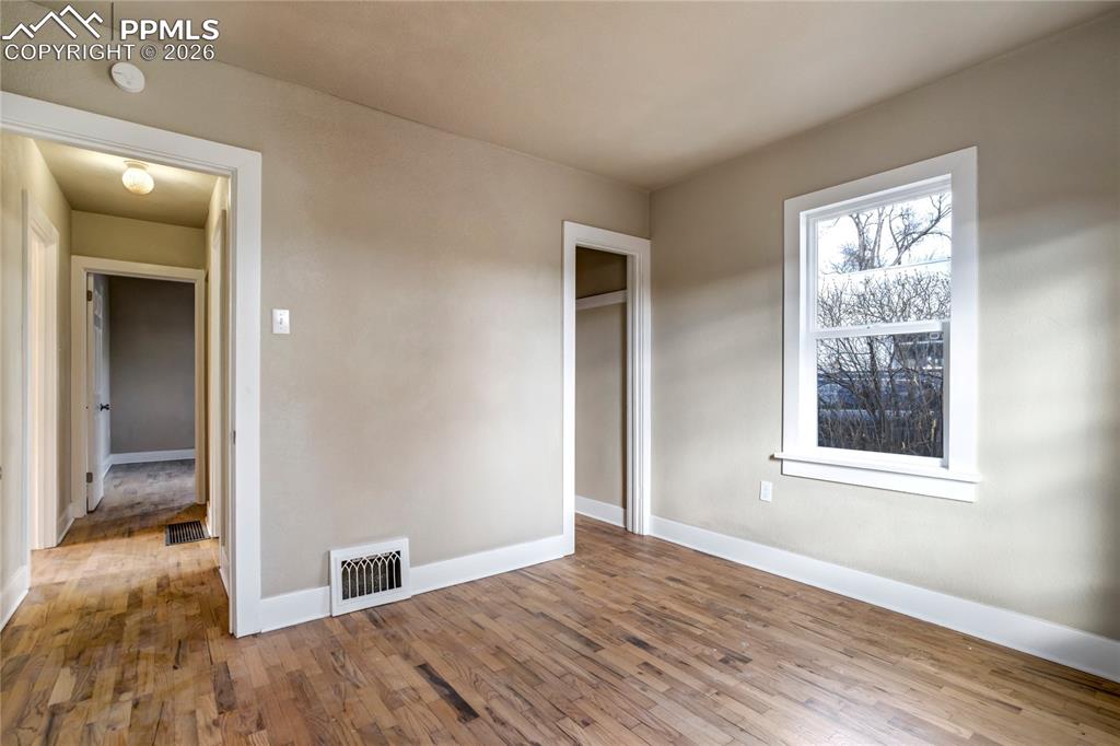 Bedroom with refinished original wood floors