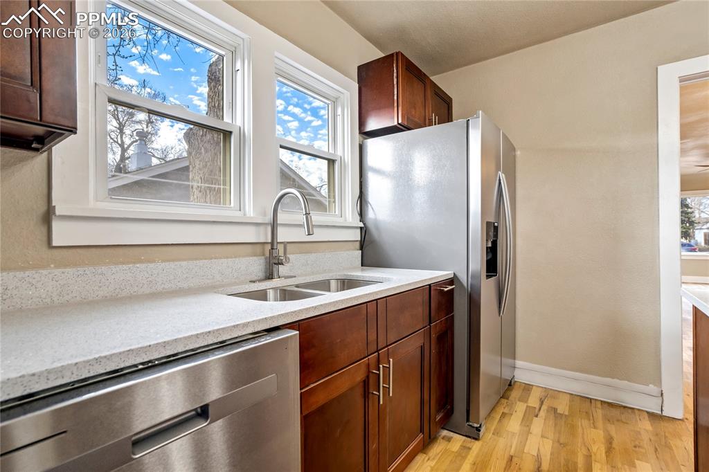 Wash dishes with a view — Pikes Peak framed from the kitchen window.