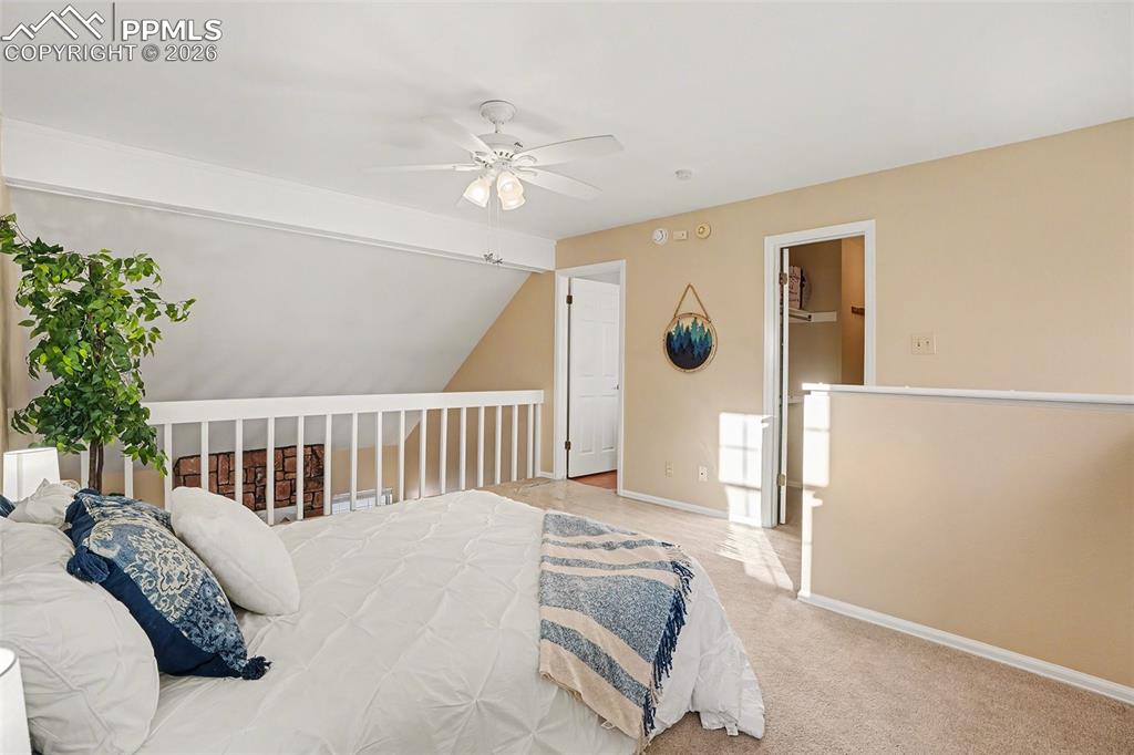 Spacious and bright primary bedroom located on the upper level, featuring an open loft-style layout with abundant natural light. Includes a generous walk-in closet, creating a comfortable and inviting private retreat.