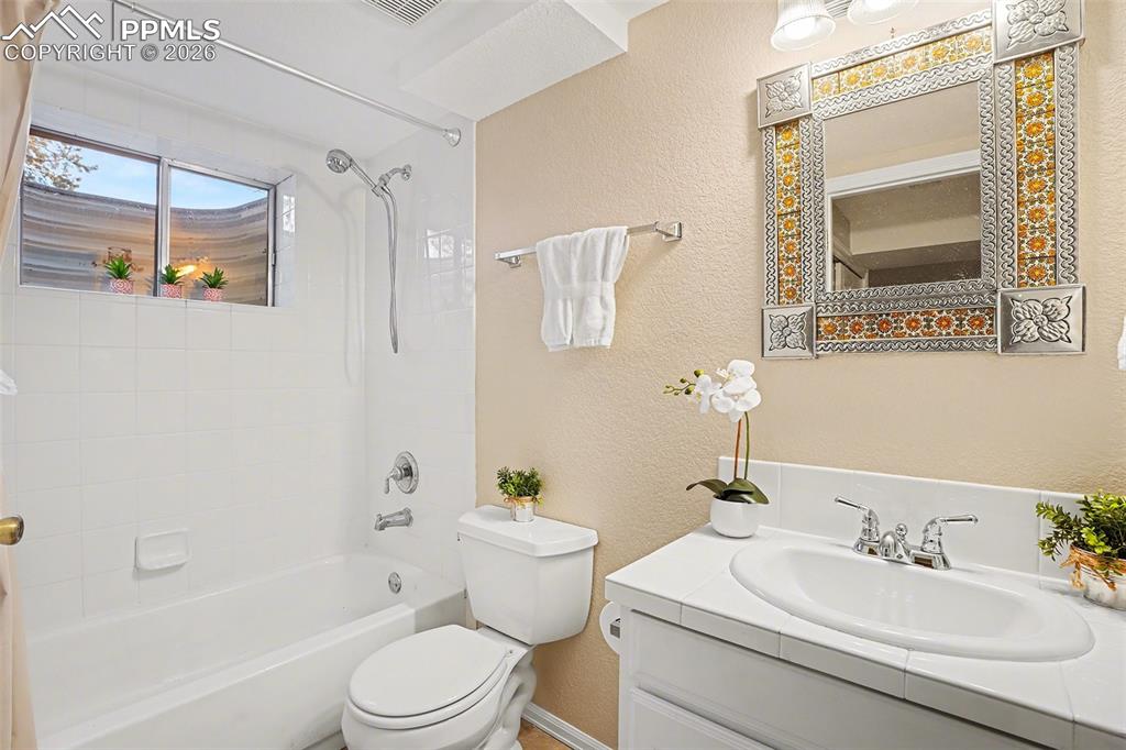 Basement bathroom conveniently set up as a Jack-and-Jill, perfect for guests