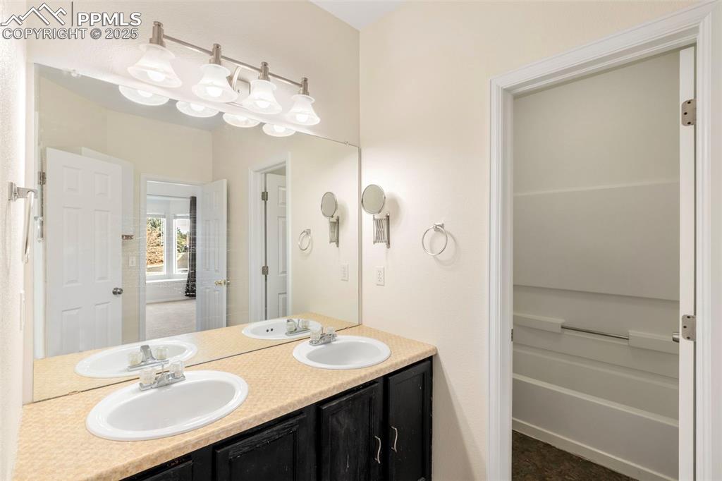 Bathroom featuring double vanity
