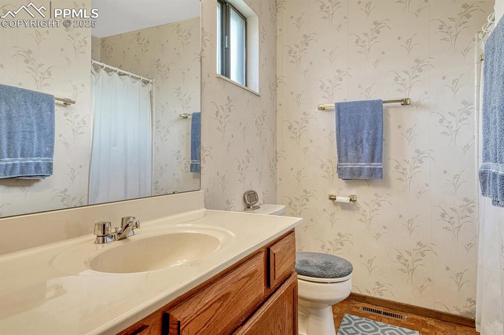 3/4 bathroom vanity, tile patterned floors. 