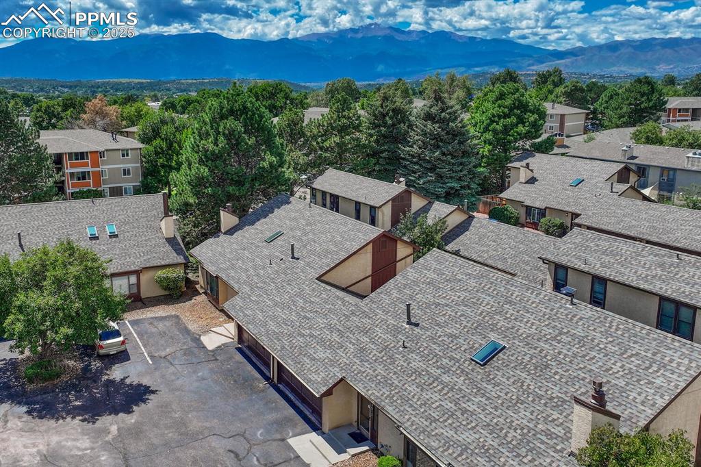 Aerial view of residential area featuring a mountainous background