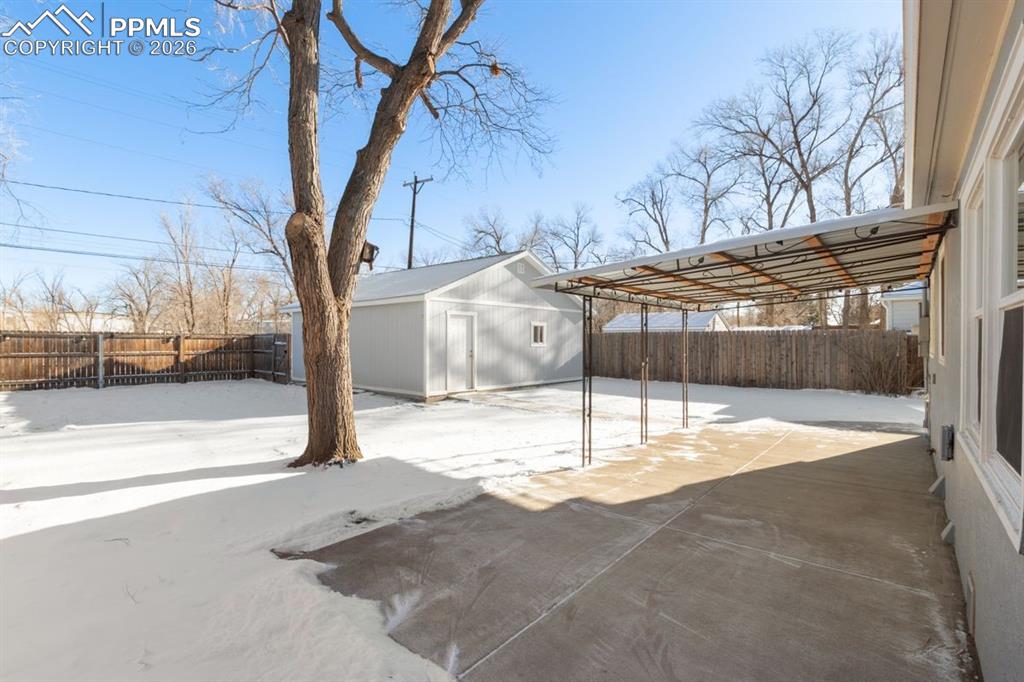 New concrete patio and metal awning.